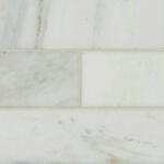Arabescato Carrara Marble 4x12 tiles feature soft white background with gray veins for character. The honed finish of this beautiful marble subway tile is ideal to create a subtle backdrop in spaces throughout homes and commercial properties. Use this white tile to create beautiful tiles for floors, accent walls, a kitchen backsplash, or countertops when a timeless, elegant surface is desired.